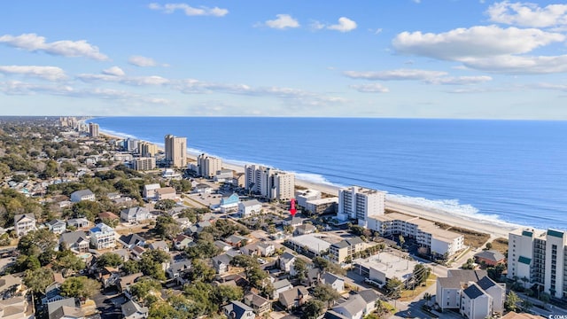 drone / aerial view featuring a view of the beach and a water view