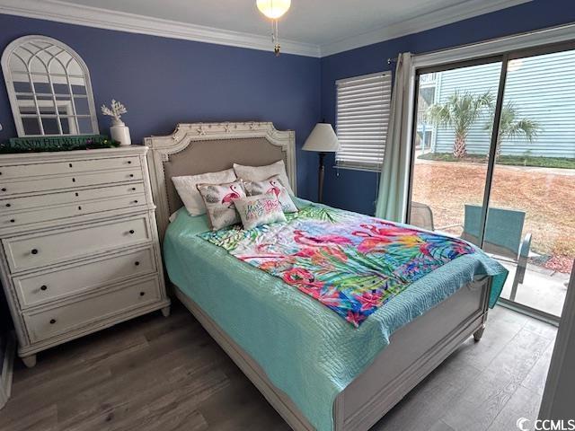 bedroom featuring wood-type flooring, access to outside, and ornamental molding