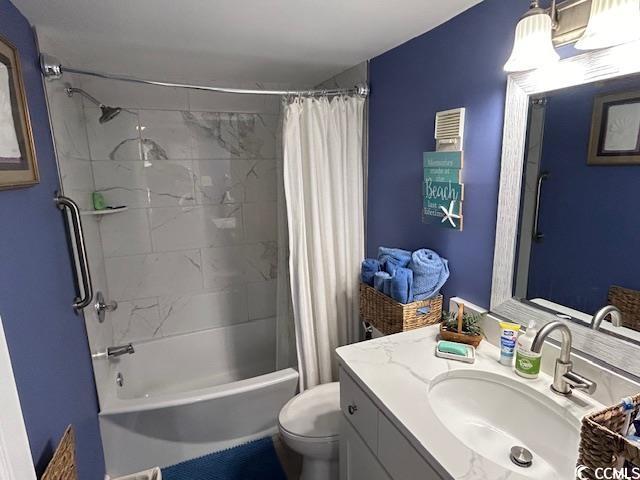 full bathroom featuring vanity, toilet, and shower / tub combo with curtain