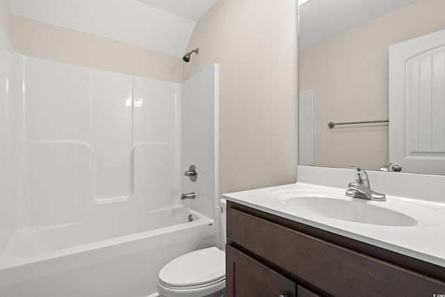 bathroom featuring vanity, toilet, and shower / bathtub combination