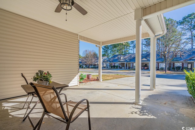 view of patio featuring a ceiling fan and a residential view