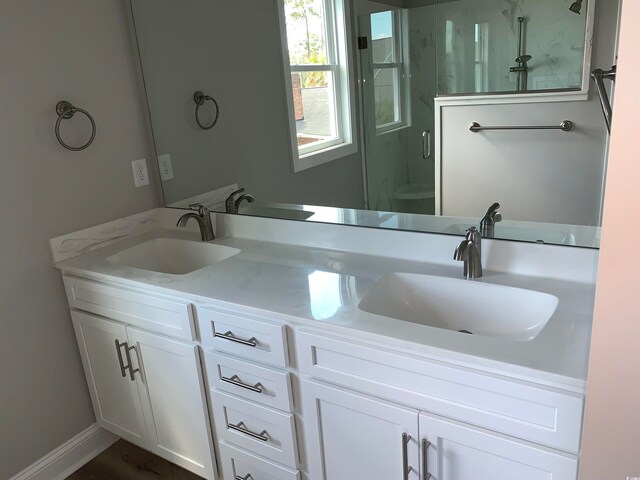 bathroom featuring dual vanity