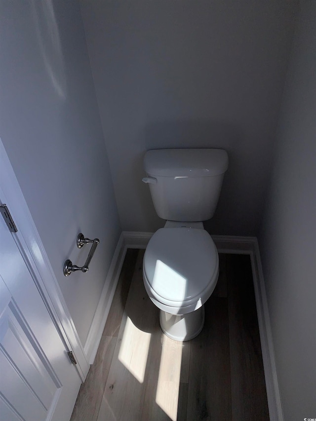 bathroom featuring toilet and hardwood / wood-style flooring