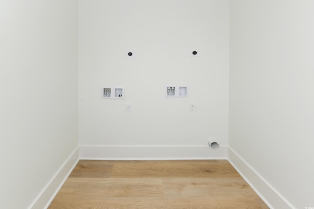 clothes washing area featuring hookup for a washing machine, electric dryer hookup, and hardwood / wood-style floors