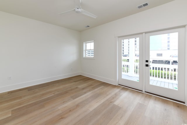 unfurnished room featuring ceiling fan and light wood-type flooring