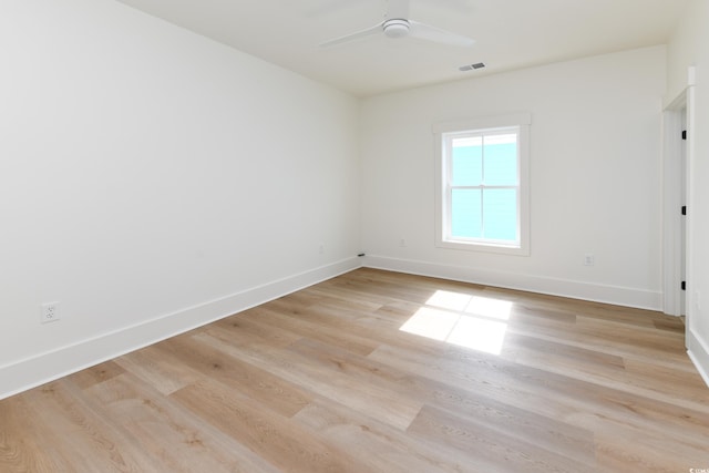 empty room featuring ceiling fan and light wood-type flooring