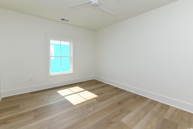 spare room featuring ceiling fan and light hardwood / wood-style flooring