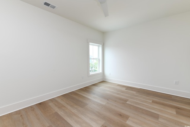 spare room featuring ceiling fan and light wood-type flooring