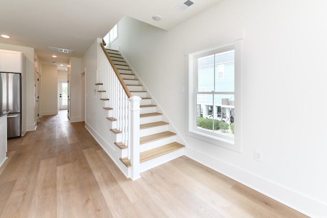 stairs with wood-type flooring