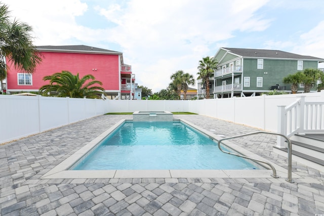 view of pool featuring an in ground hot tub and a patio area