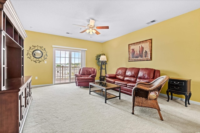 living room featuring ceiling fan and light carpet