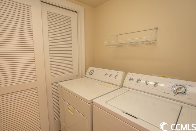 washroom with washer and dryer