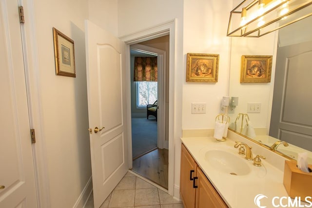 bathroom featuring large vanity and hardwood / wood-style flooring