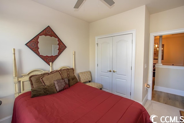 bedroom featuring light hardwood / wood-style floors, a closet, and ceiling fan