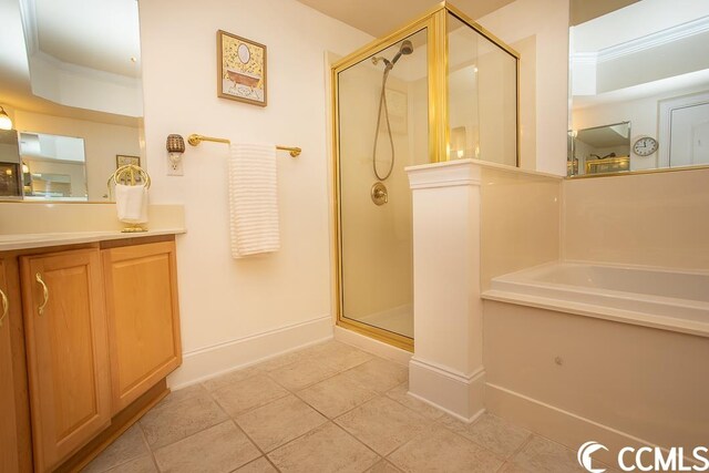 bathroom with tile flooring, ornamental molding, vanity, and independent shower and bath