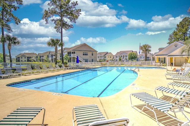 view of swimming pool with a patio area