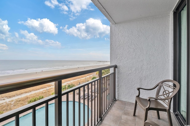 balcony with a view of the beach and a water view