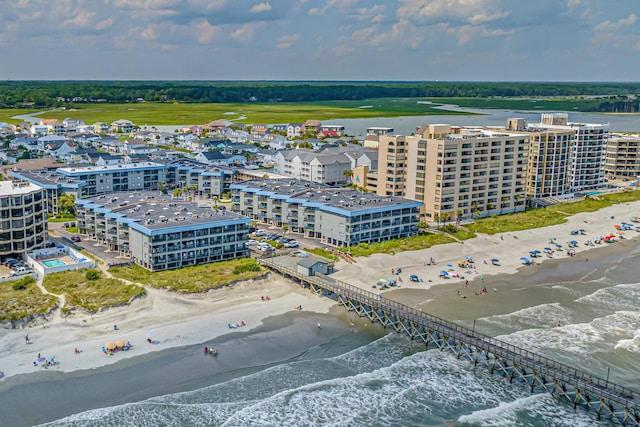 aerial view featuring a water view and a beach view