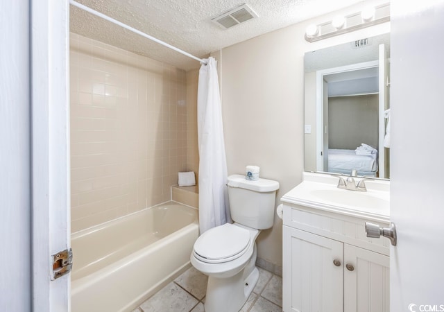 full bathroom with vanity, tile patterned flooring, a textured ceiling, shower / tub combo, and toilet