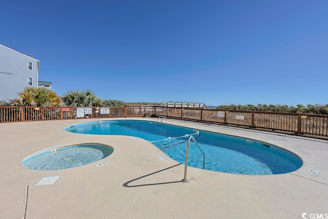 view of pool featuring a patio