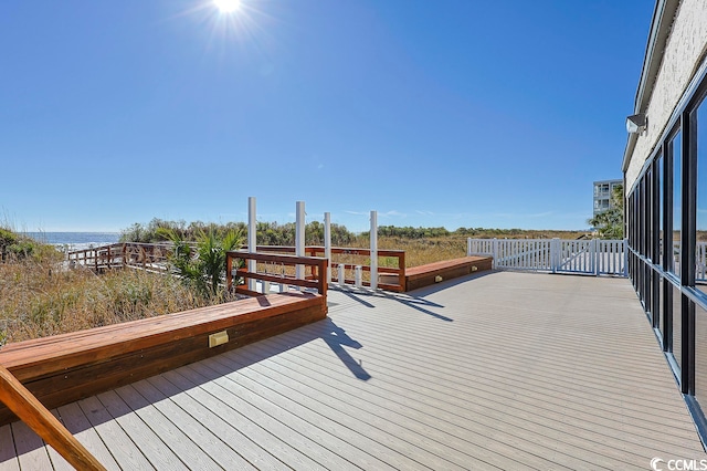 wooden deck featuring a water view