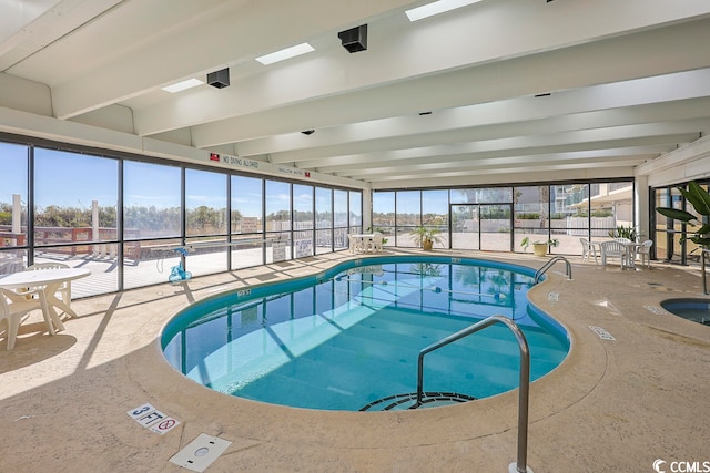 view of pool with an indoor hot tub