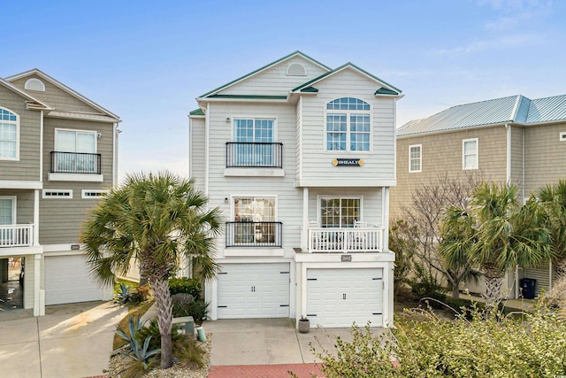 view of front of home with a balcony and a garage