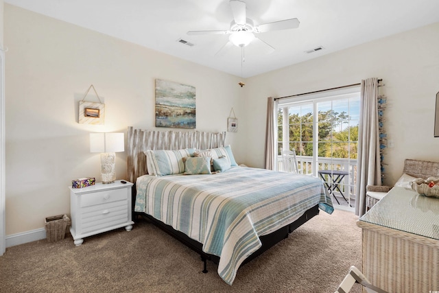 bedroom featuring ceiling fan, multiple windows, dark hardwood / wood-style floors, and access to exterior