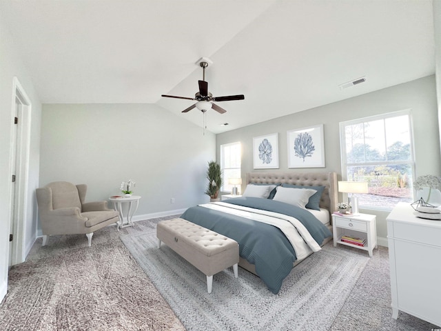 bedroom featuring ceiling fan, carpet flooring, and lofted ceiling