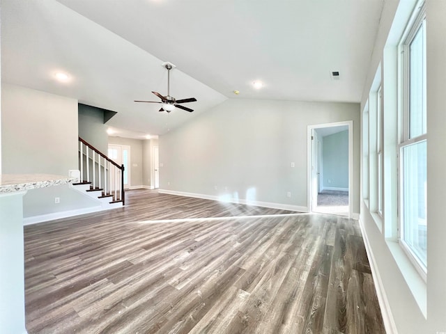 unfurnished living room with lofted ceiling, wood-type flooring, and ceiling fan