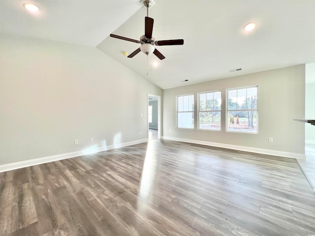 unfurnished living room featuring ceiling fan, hardwood / wood-style flooring, and vaulted ceiling