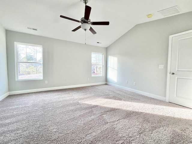 unfurnished room with ceiling fan, carpet flooring, and vaulted ceiling