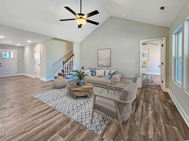 living room featuring ceiling fan, high vaulted ceiling, and wood-type flooring