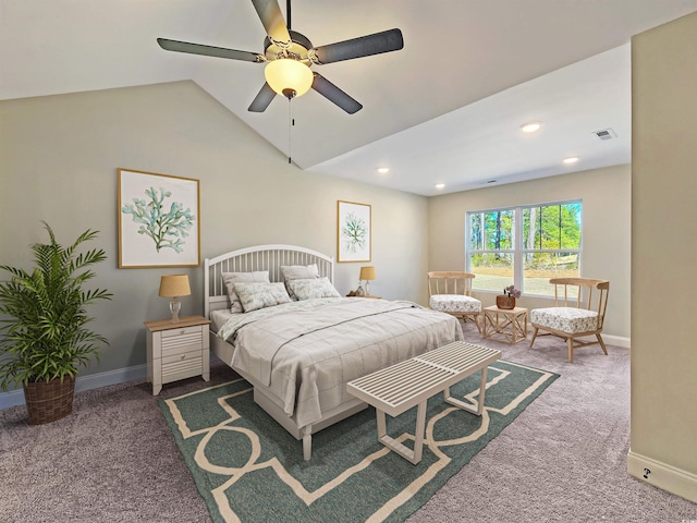 bedroom featuring ceiling fan, vaulted ceiling, and dark carpet