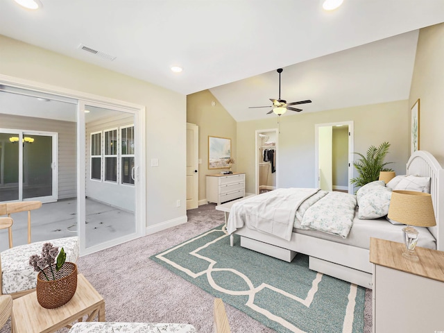 bedroom featuring access to outside, a walk in closet, ceiling fan, lofted ceiling, and carpet