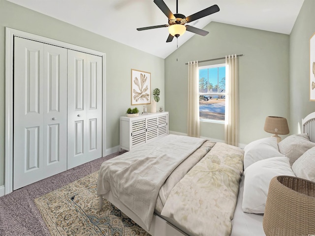 bedroom featuring a closet, ceiling fan, vaulted ceiling, and carpet floors