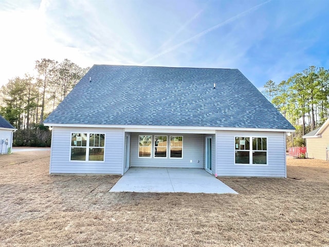 back of property with a patio area