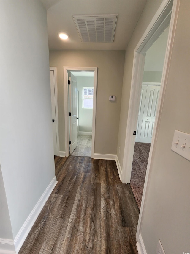 hallway featuring dark hardwood / wood-style floors