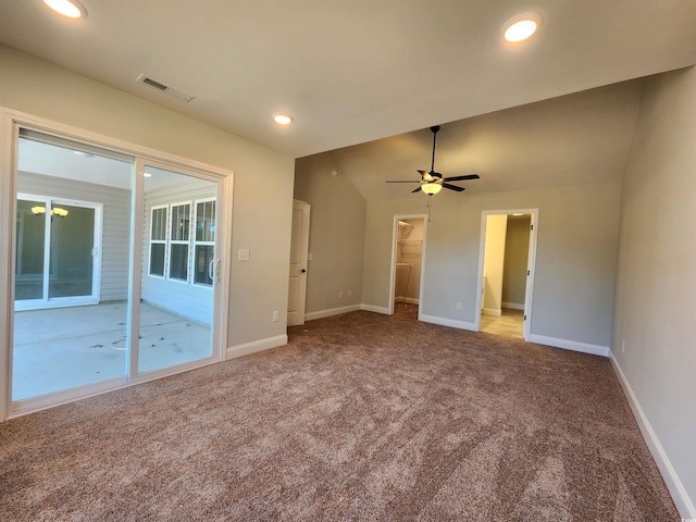 unfurnished room with ceiling fan, light carpet, and lofted ceiling