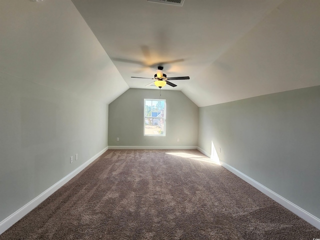 additional living space featuring ceiling fan, carpet, and vaulted ceiling