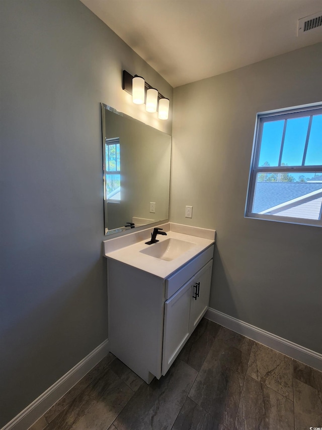 bathroom with vanity and hardwood / wood-style floors