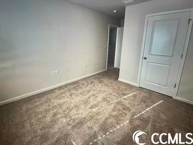 unfurnished bedroom with carpet flooring