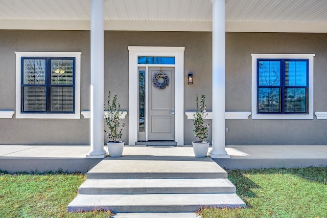 entrance to property featuring a porch