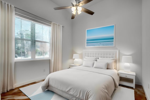 bedroom with hardwood / wood-style flooring and ceiling fan