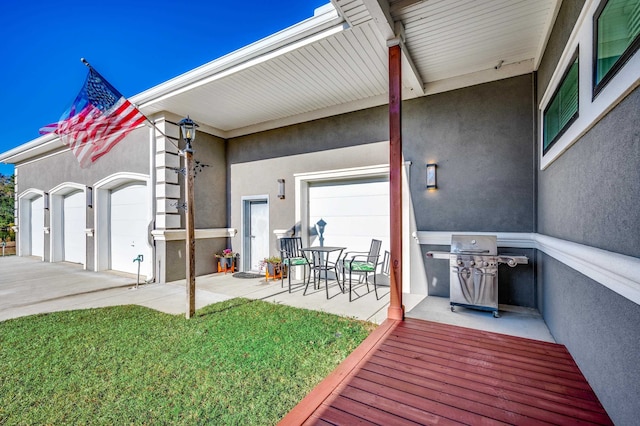 exterior space featuring a garage and a lawn