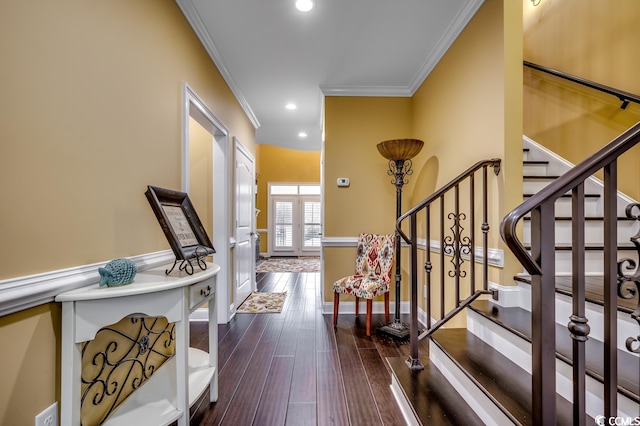 entryway featuring ornamental molding and dark wood-type flooring