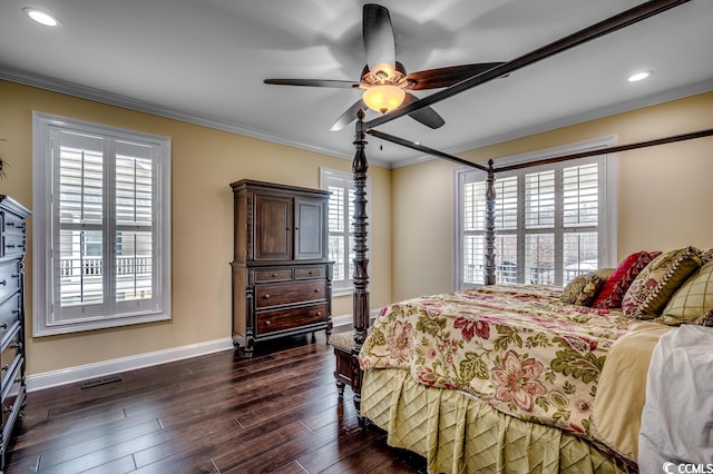 bedroom featuring crown molding, dark hardwood / wood-style flooring, and ceiling fan