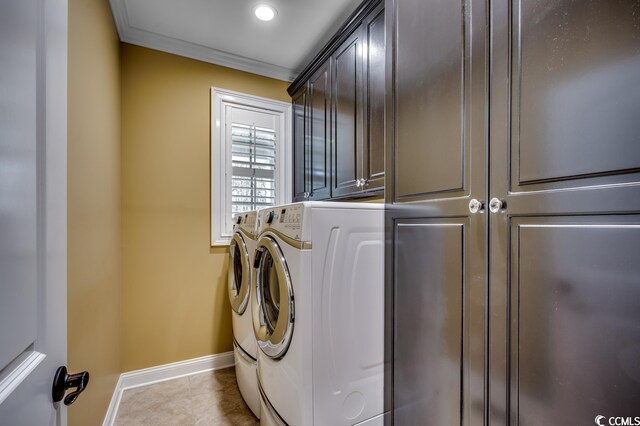 clothes washing area featuring independent washer and dryer, light tile floors, cabinets, and crown molding