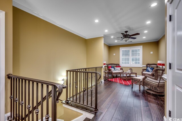 hallway featuring crown molding and dark hardwood / wood-style flooring