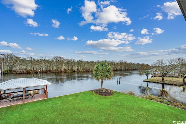 dock area featuring a water view and a lawn